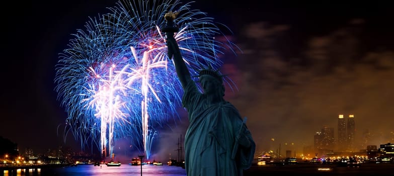The silhouette of Statue of Liberty Statue of Liberty and July 4th fireworks over Hudson River