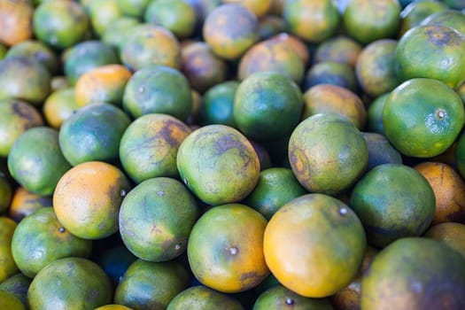 Orange fruit at the vegetable market in Phuket, Thailand