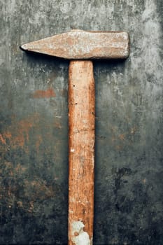 Old hammer on steel surface. Tool for maintenance. Hardware tool to fix. Technical background with copy space