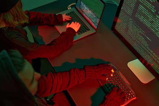 Anonymous people using computer and programming to break code. Cyber security threat. Internet and network security. Access to private information. Anonymous hackers using technology to access to password and encrypted data. Cyber attack