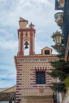 Ronda, Spain, April 2023: View on the bell tower of Church of Our Lady of Peace in Ronda, located on the Plaza Del Beato Diego Jose de Cadiz