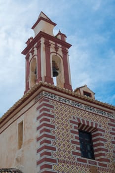 Ronda, Spain, April 2023: View on the bell tower of Church of Our Lady of Peace in Ronda, located on the Plaza Del Beato Diego Jose de Cadiz