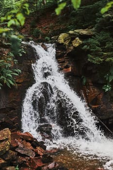 Mountain waterfall. Mountain landscape. Natural scene. Beauty in nature