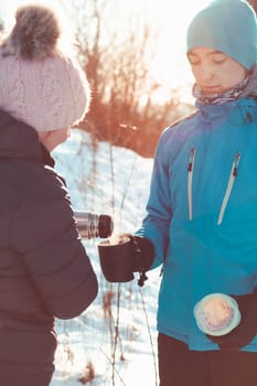 Break for hot drink during the winter trip