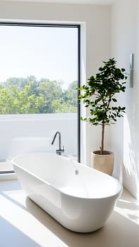Scandinavian style bathroom interior in light colors. The bathtub is located near the window. High quality photo