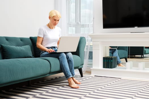 Middle aged woman getting ready for online streaming from home