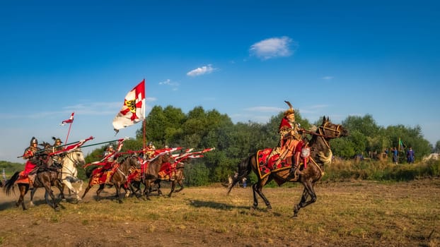 Gniew, Poland, Aug 2020 Castellan leading the charge of Hussars, on enemy forces, historical reenactment of Battle of Gniew