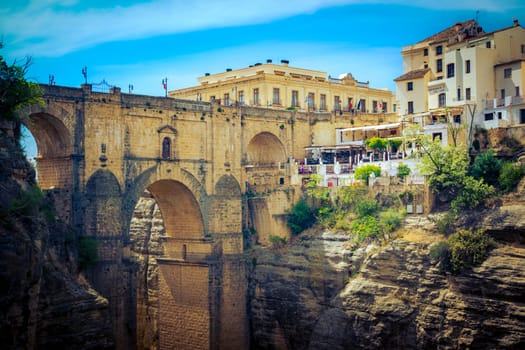 Ronda, Spain, April 2023: Famous view on the Puente Nuevo crossing the El Tajo Canyon in Ronda, cozy historical city in Andalusia, Spain