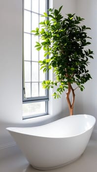 Scandinavian style bathroom interior in light colors. The bathtub is located near the window. High quality photo