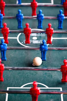 Table football game sport competition two competitors players on field. Closeup of players
