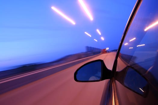 speed drive on car at night motion blurred