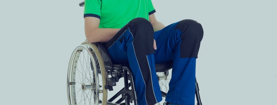 young man in a wheelchair in front of white background