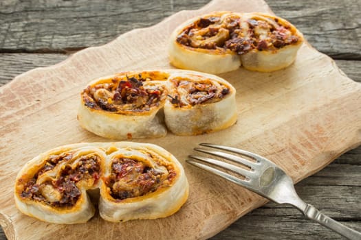 Pork ears Pastry from puff pastry with tomato pine nuts Filling