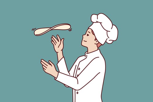 Man chef prepares pizza by tossing dough in open kitchen restaurant with traditional italian food. Guy in chef hat works in pizzeria and cook pizza according to classic old recipe.