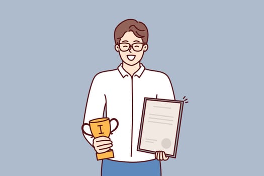 Businessman holds certificate and cup winner of competition among sellers company who exceeded sales plan. Businessman boasts letter of thanks received from partners corporation or managers