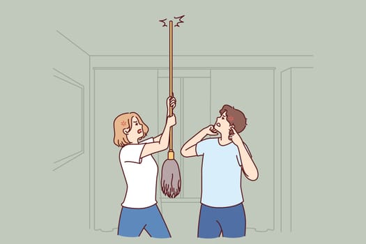 Young couple bangs on ceiling with mop urging neighbors to stop party or turn off loud music. Angry men and women use mop suffer from noisy neighbors not respecting rules of living together