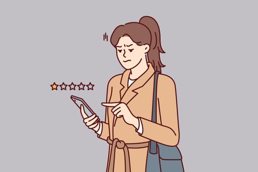 Woman with phone shares user experience by giving negative rating to store or restaurant. Girl uses mobile application on smartphone to put one star and lower company rating due to poor service