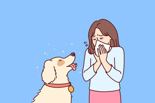 Little girl with dog suffers from allergies and uses handkerchief when communicating with beloved pet. Teenager child blows nose into paper napkin due to allergies or rhinitis caused by dog hair