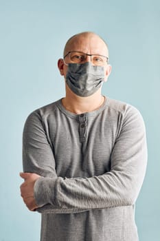Man patient with face mask. Wearing coronavirus covid-19 protection medical mask during the pandemic