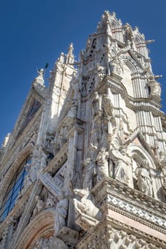 Side view of facade of Siena Cathedral. Siena, Italy