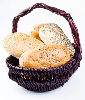 Several differend kind of rolls in basket isolated over white