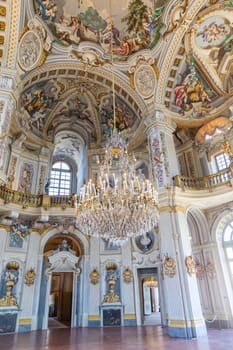 Italy, Stupinigi - January 2023: luxury interior of Royal Palace with baroque marbles and windows