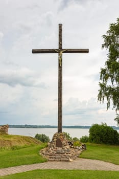 Wooden cross with Jesus on it. Near catholic church in Ludza, Latvia.