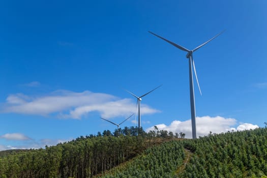 Wind turbines on blue sky in nature. Galiza, North of Spain