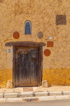 Mazarife, Castile and Leon, Spain: 12 August 2022: Villar de Mazarife famous old door, province Leon, Spain. Camino de Santiago.