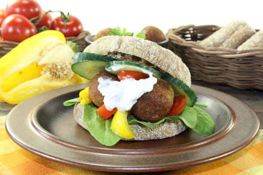 Falafel with fresh salad against a bright background