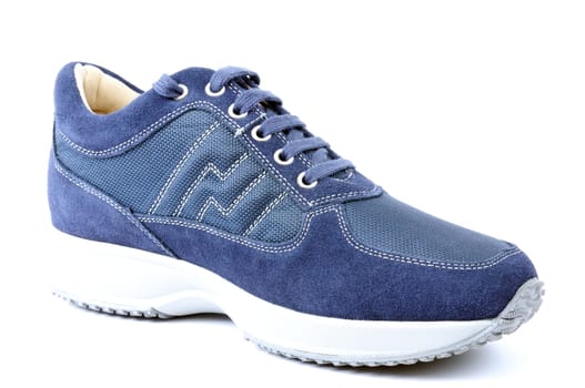 Sports shoes for adult man photographed on white background.