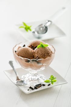 Fresh chocolate ice cream in crystal glass.