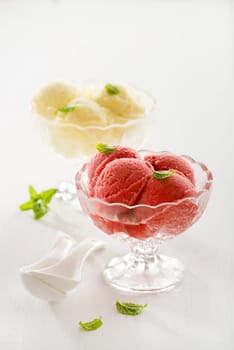 Fresh fruit ice cream in crystal glasses.