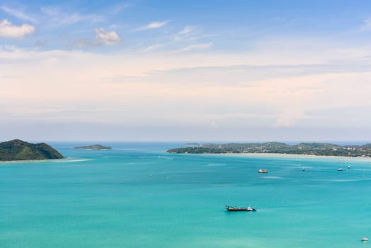High angle view blue sky over the Andaman Sea and seaside tourist town from Khao-Khad mountain viewpoint famous attractions in Phuket island, Thailand