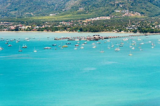 High angle view pier for travel boat at Ao Chalong bay in Phuket Island is a tourist town by the sea from Khao-Khad mountain viewpoint famous attractions of Thailand