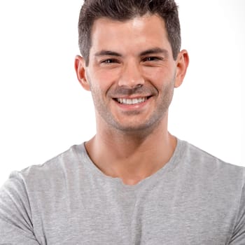 Portrait of a handsome latin man smiling, isolated over a white background