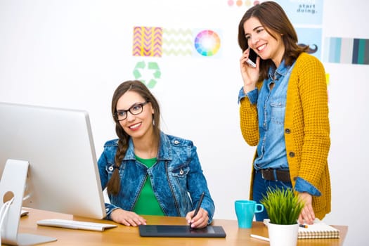 Women working at desk In a creative office, team work