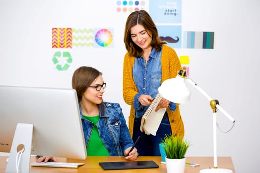 Women working at desk In a creative office, team work