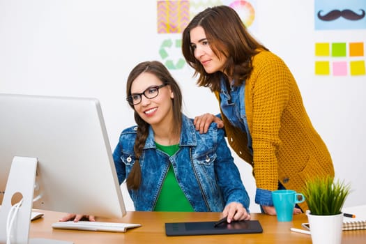 Women working at desk In a creative office, team work
