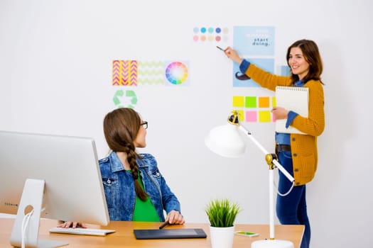 Women working at desk In a creative office, team work