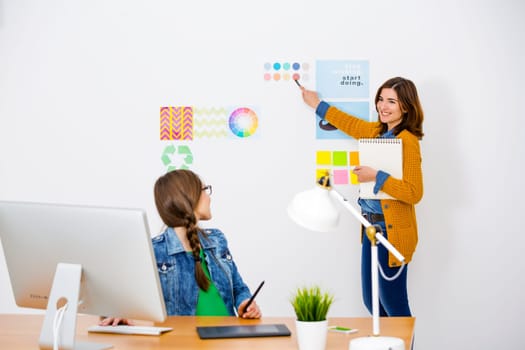 Women working at desk In a creative office, team work