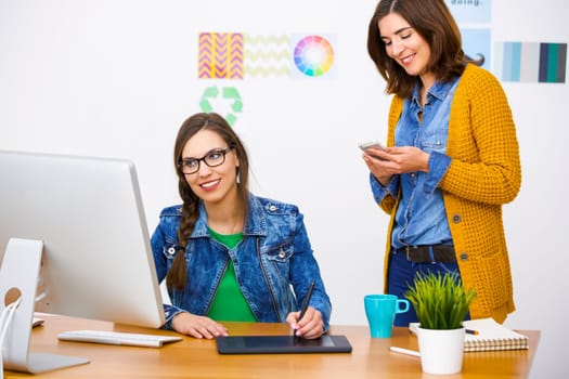 Women working at desk In a creative office, team work