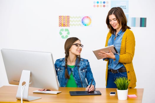 Women working at desk In a creative office, team work