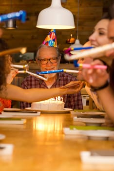 Big family celebrate the birthday of the grandfather