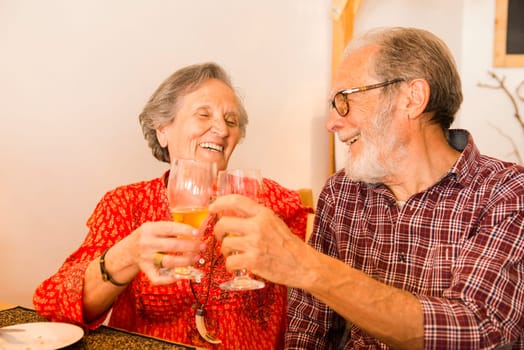 Old couple at the restaurant and  having a good time