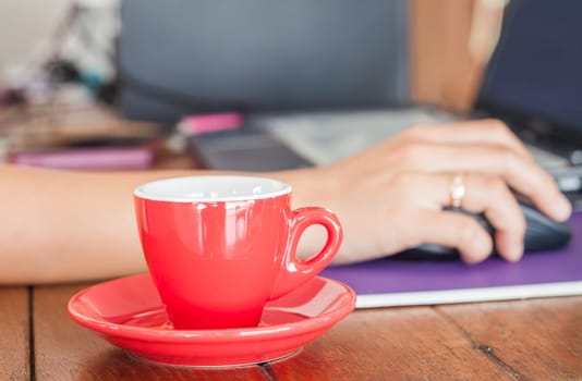 Red coffee cup on work station, stock photo