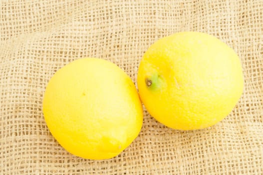 bacground of natural lemon on jute