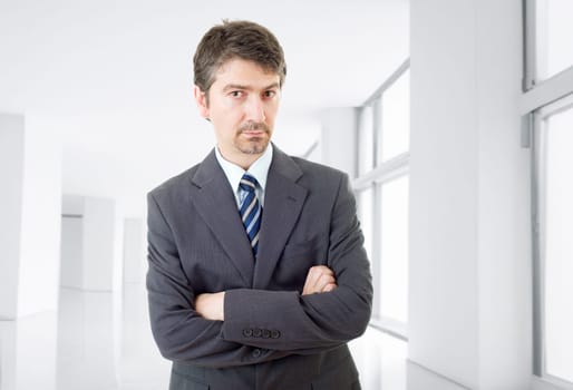 young business man thinking, at the office