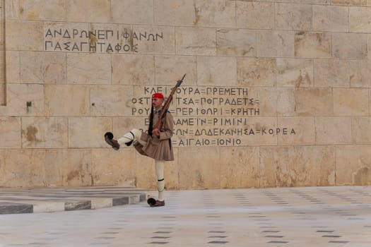 ATHENS, GREECE - MAY 06 2022: Presidential ceremonial guards - Evzones at the Tomb of the Unknown Soldier in front of the Greek Parliament, Athens, Greece