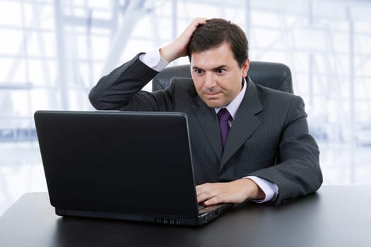 business man working with is laptop at the office
